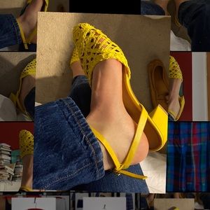 Yellow strappy sandals with a tiny heel.